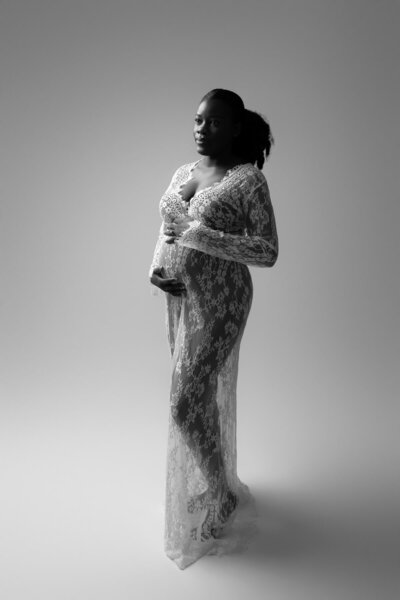 White lace sheer long sleeve gown with soft train, ideal for editorial maternity looks