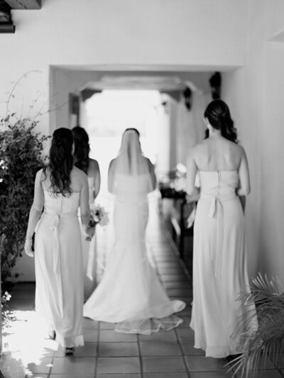 Bride walking with bridesmaids