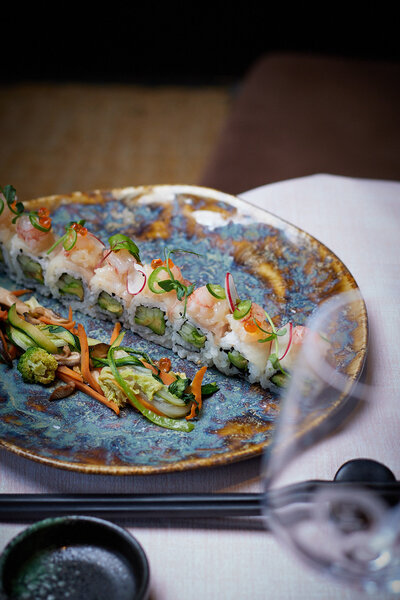 Sushi with sautéed mixed vegetables.