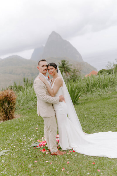 Bride and groom with the Pitons in the background at La Haut Resort in St. Lucia.
