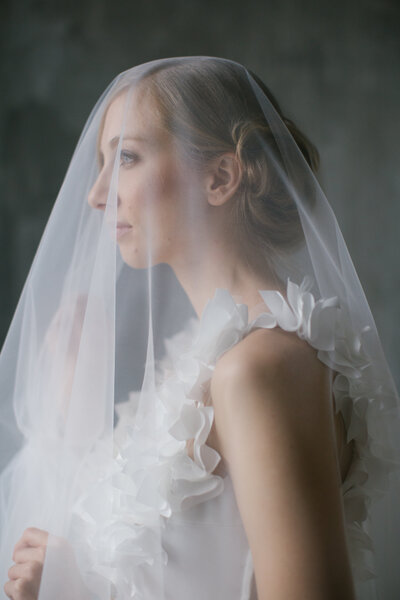 Bridal portrait with sheer veil and floral detailing — fine art wedding photography in Germany