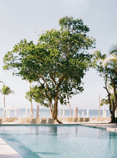 Fine art photograph of the pool at Casa de Campo, a luxury coastal wedding destination in the Dominican Republic, captured by destination wedding photographer Melissa Piontkowski.