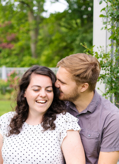 Newlyweds, Kelsie and Zack Hamilton, laugh as Zack nuzzles into Kelsie's hair at Inniswood Metro Park in Westerville. Ohio.