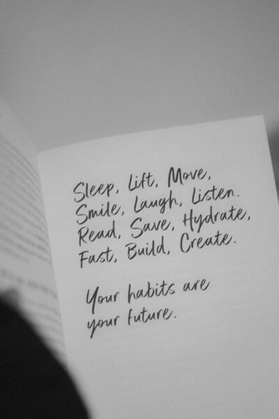 A book page with handwritten text lists positive habits like "Sleep, Lift, Move," followed by "Your habits are your future"—an inspiring touch from Sweet Pea Ink Creative, perfect for any aspiring brand strategist or web design enthusiast.