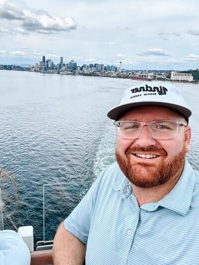 Jace Tarbell smiling on a boat during a luxury trip — highlighting his hands-on approach to personalized travel planning.