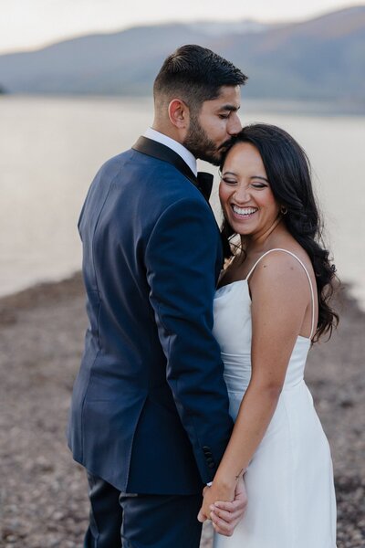 Couple holds hands during Colorado elopement photos.