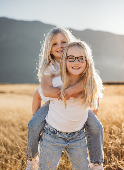 girls having fun during a family photoshoot with Captured by Bie in Wanaka