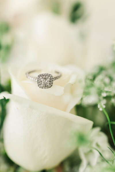 ring with white roses during wedding photo session in upstate ny