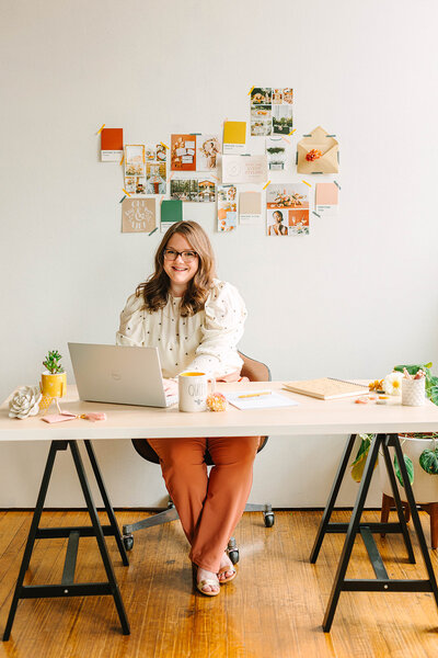 Katelynn at a desk working on a laptop