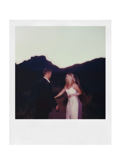 polaroid of a couple dancing in the desert