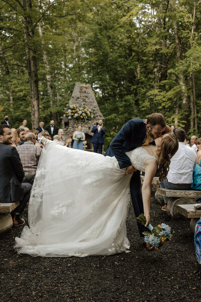 bride and groom hold hands after wedding in new hampshire