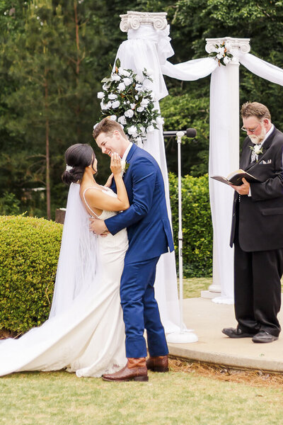 Bride and groom embrace at Alabama wedding
