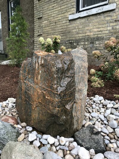 landscape installation of stones and rocks by Helena's Gardening