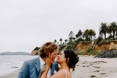 couple kissing on the beach