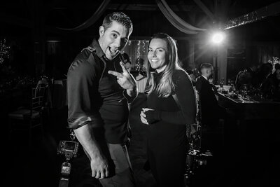 Central New Jersey Wedding Photographers Nick and Kelly strike a fun pose while shooting a wedding