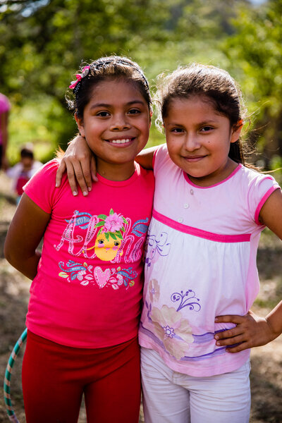 Portrait of friends glowing in the sun on a photography travel trip with a nonprofit from VA Beach