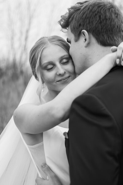 bride and groom outdoors in field in Sterling Heights Michigan