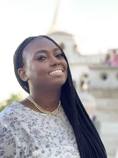 Tourist black woman smiling in St. Stephens Basilica, Budapest, Hungary