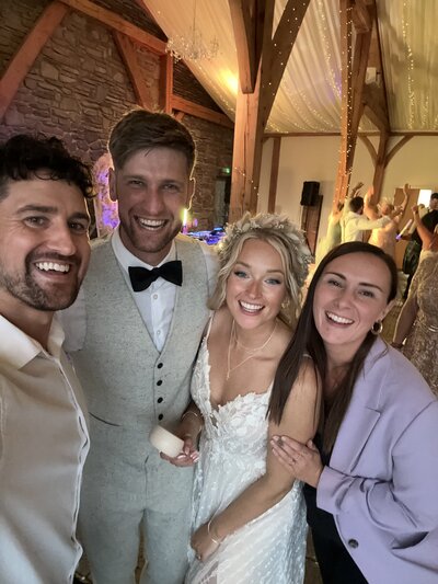 Amy & Nick posing with couple