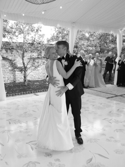 Bride and groom have their first dance at their wedding reception