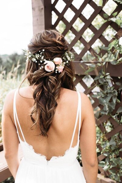 Bride having her wedding hair accessory placed in her updo