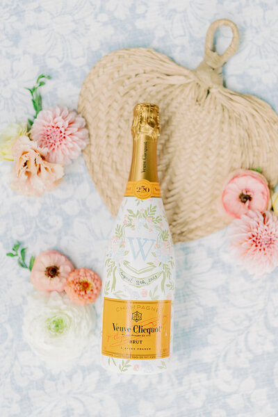 Veuve Clicquot painted bottle with wedding crest by Alicia Betz of The Welcoming District.