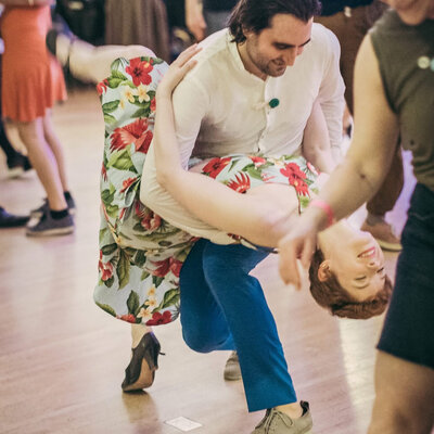 Ashley Laabs swing dancing in a ballroom
