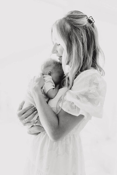 Newborn peacefully sleeping in a cozy wrap, captured by Vanessa Montano Photography — Brentwood Newborn Photographer creating timeless portraits.
