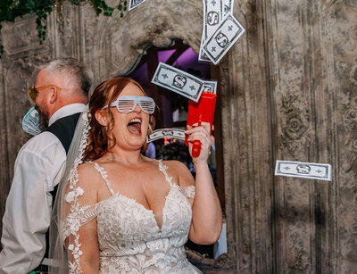 Bride with money machine on wedding day 