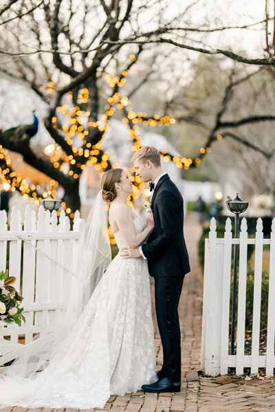 Formal bride & groom photo taken on the long drive way leading up to the main house at Inola. Photo taken by Chicago + Atlanta Photographer Ella Grace Richards of Forever Love Photography 