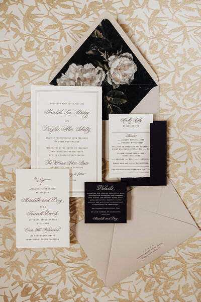 Wedding details with rings and invites