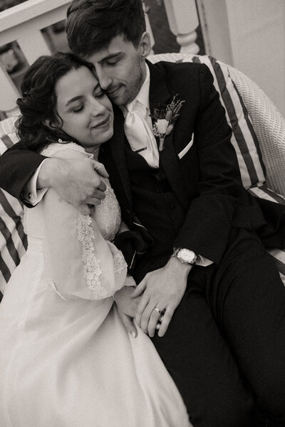 candid photo of bride and groom cuddling, candid wedding photographer