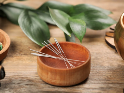 Chris Warden, owner and physical therapist at Embody Health & Performance, working with a patient