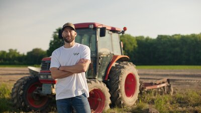 Marty standing in front of tractor