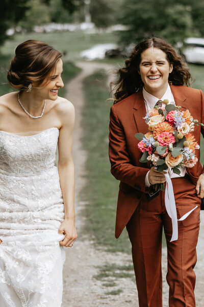 Bride and member of Bridal party walking together, Buxton School Wedding