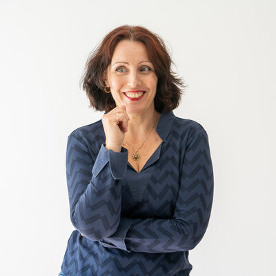 Csilla smiling and looking to the side.