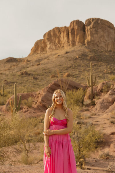 girl poses for senior portrait in arizona desert