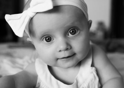 baby girl looking at camera