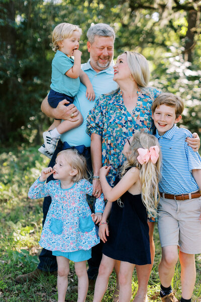 family of four dressed in blue and black