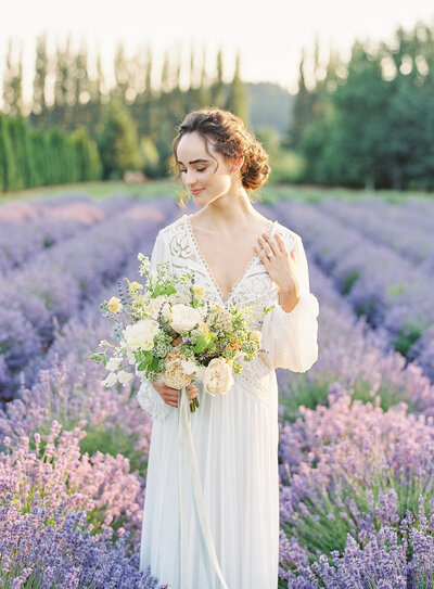 Photo of a bride and groom embracing in a hug in a purple lavender field in Woodinville, Washington