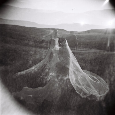 bride and groom holding each other in black and white