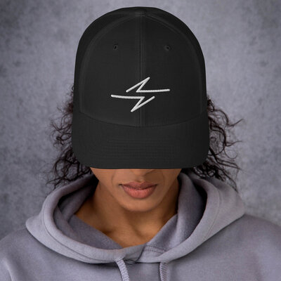 Bolt Cap by She Rocked It. Perfect trucker hat gift for phenomenal women and girl power who want to live your truth with feminist apparel, female empowerment gifts, and feminist clothing.