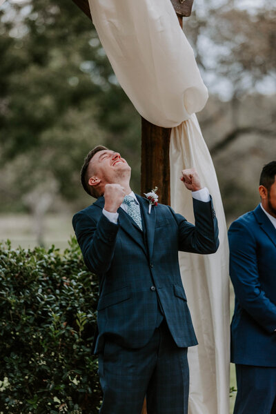 groom pumping his fists