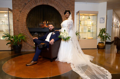 Dmv wedding photographer - groom seated bride standing