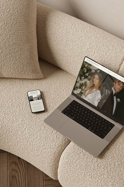 Mobile display of wedding photography website with headline “I capture the most beautiful love stories,” featuring elegant serif typography and black-and-white bridal portrait.