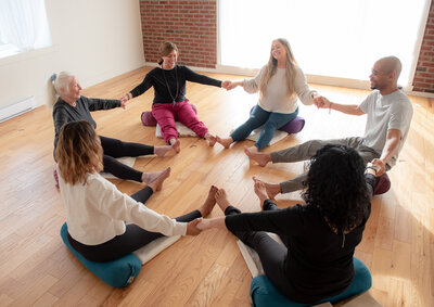 yogis in a circle laughing