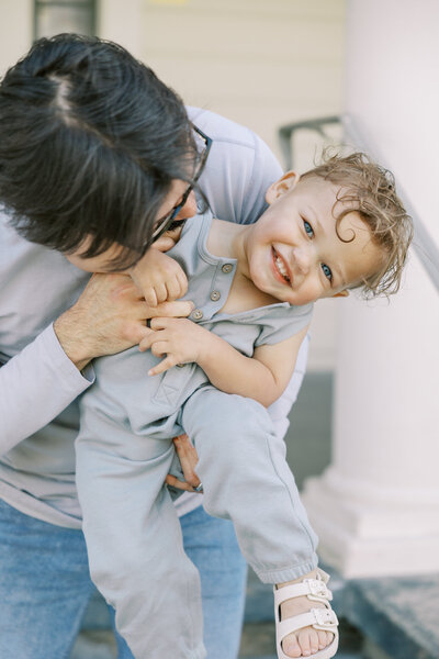 Playful moment between father and son during Fresno family session