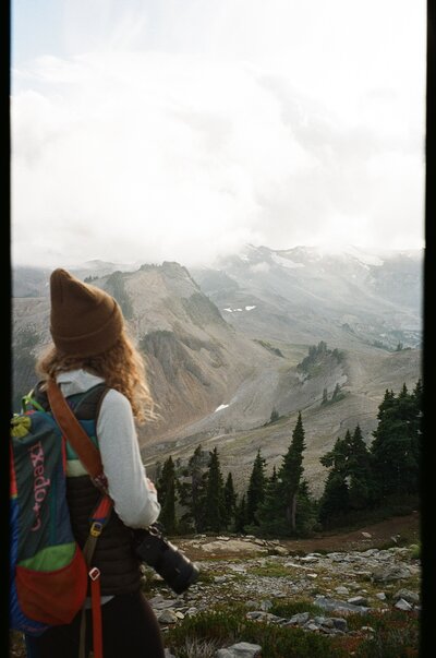 woman holding camera in beautiful location