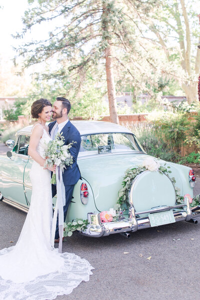 Couple kissing under vail