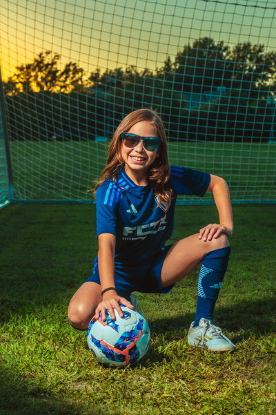 Soccer player posing with ball